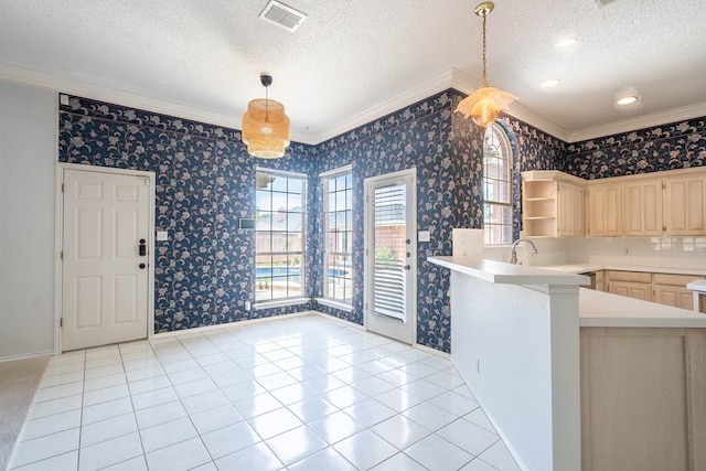 5500 Drexel, Midland, TX 79707 - kitchen with light brown cabinets, crown molding, wallpapered walls, a textured ceiling, and light countertops