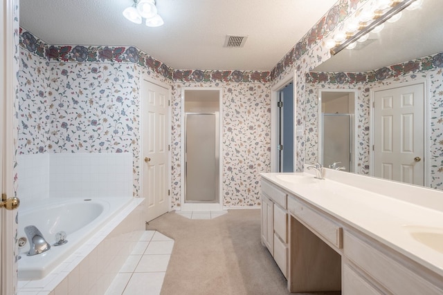 5500 Drexel, Midland, TX 79707 - full bathroom with wallpapered walls, a stall shower, a bath, and double vanity
