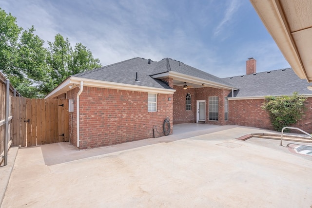 5500 Drexel, Midland, TX 79707 - rear view of property with brick siding, roof with shingles, a patio, a chimney, and ceiling fan