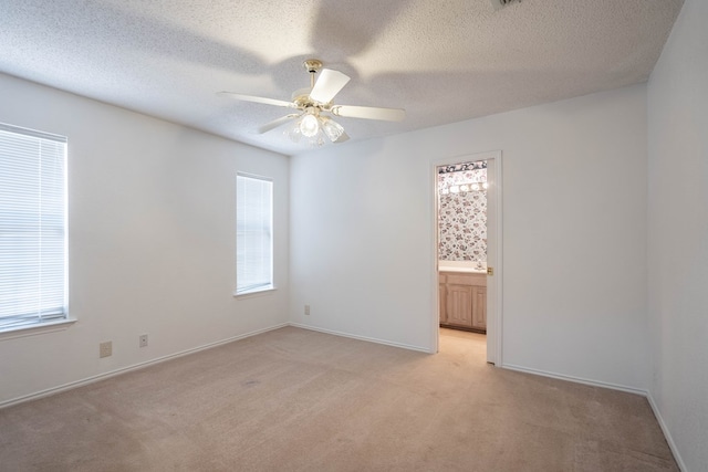 5500 Drexel, Midland, TX 79707 - unfurnished room featuring light carpet, a ceiling fan, and a textured ceiling