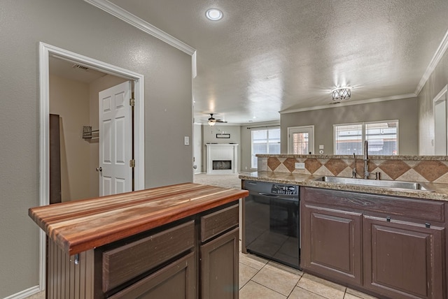 kitchen featuring wooden counters, a textured ceiling, a sink, ornamental molding, and black dishwasher