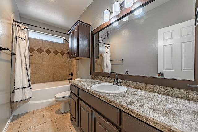 bathroom with vanity, tile patterned flooring, toilet, and shower / tub combo