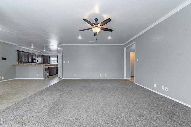 unfurnished living room with ornamental molding, baseboards, recessed lighting, a ceiling fan, and carpet