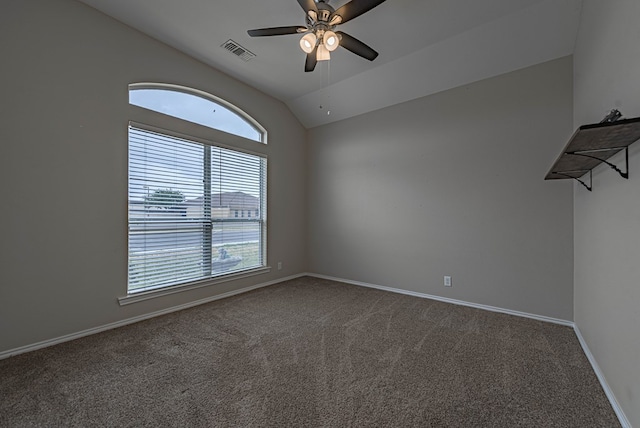 carpeted empty room with a ceiling fan, baseboards, visible vents, and plenty of natural light