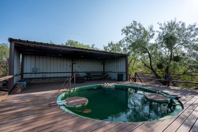 view of pool featuring a deck