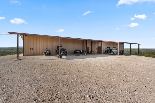 view of outbuilding with a carport