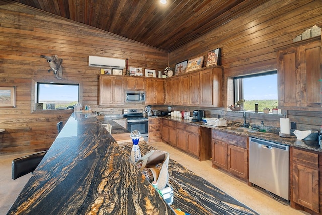 kitchen featuring dark stone counters, wood ceiling, lofted ceiling, and appliances with stainless steel finishes