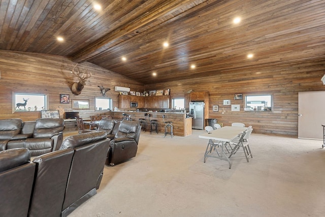 carpeted living room with a wall mounted AC, high vaulted ceiling, wooden ceiling, beamed ceiling, and wood walls