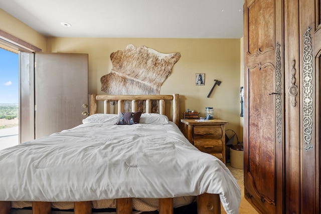 carpeted bedroom with multiple windows