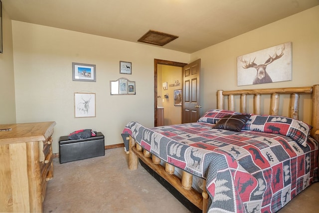 bedroom featuring concrete flooring