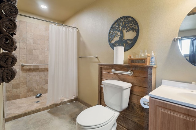 bathroom with concrete floors, vanity, a shower with shower curtain, and toilet