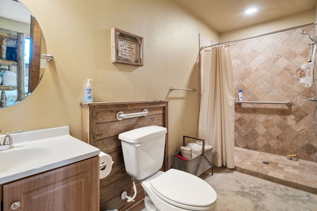 bathroom featuring curtained shower, vanity, and toilet