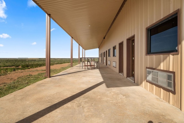 view of patio with a rural view and heating unit