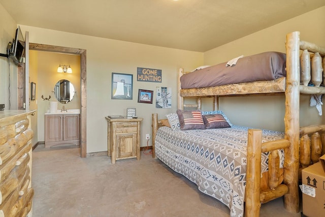 bedroom with sink and light colored carpet