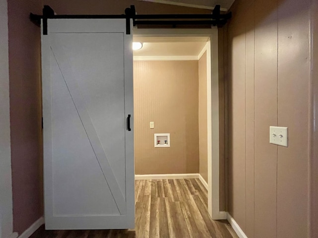 2508 31st St, Snyder, TX 79549 - hallway with hardwood / wood-style flooring and a barn door