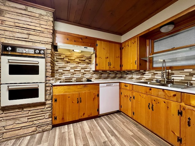 2508 31st St, Snyder, TX 79549 - kitchen featuring sink, tasteful backsplash, wood ceiling, light wood-type flooring, and white appliances