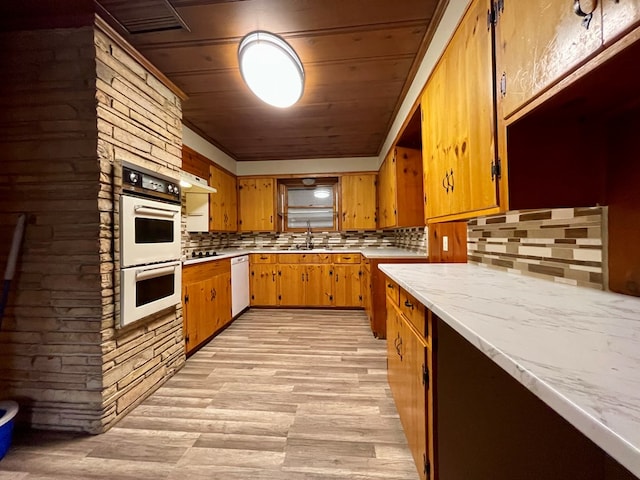 2508 31st St, Snyder, TX 79549 - kitchen with tasteful backsplash, white appliances, sink, and wooden ceiling