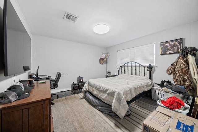 bedroom featuring visible vents