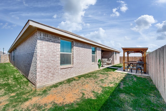 exterior space featuring a lawn and a patio area