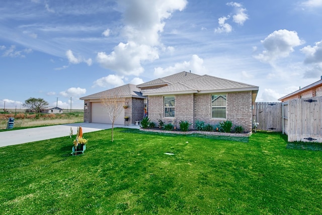 ranch-style home featuring a garage and a front lawn