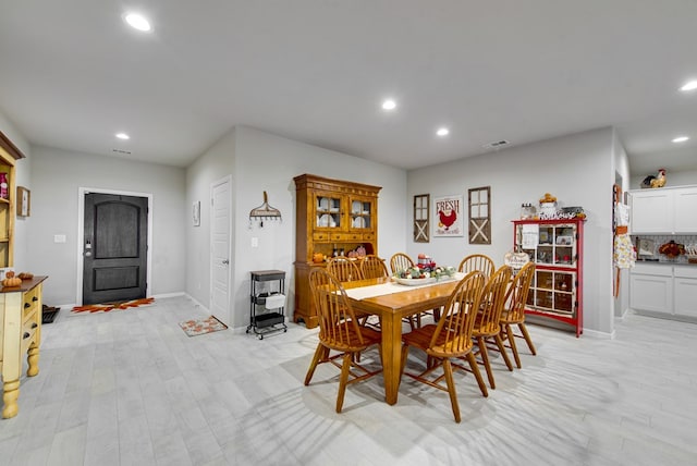 dining room featuring light hardwood / wood-style flooring