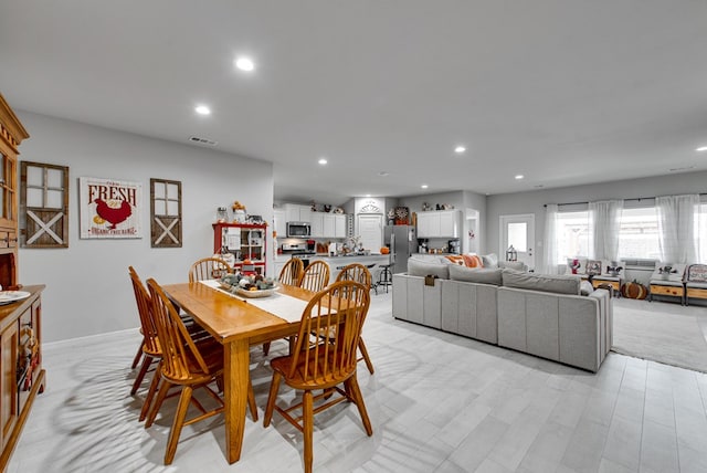 dining room featuring light hardwood / wood-style flooring