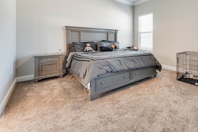 carpeted bedroom featuring baseboards and ornamental molding