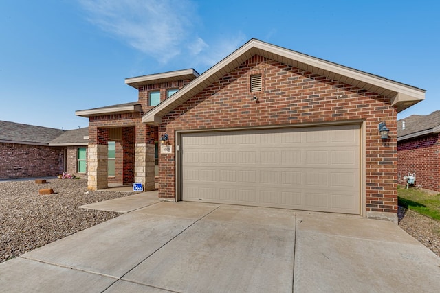 view of front of home with an attached garage, brick siding, and driveway