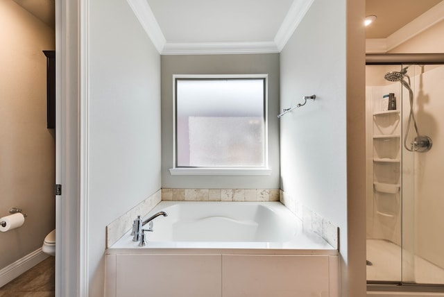 bathroom featuring a garden tub, a shower stall, ornamental molding, and toilet