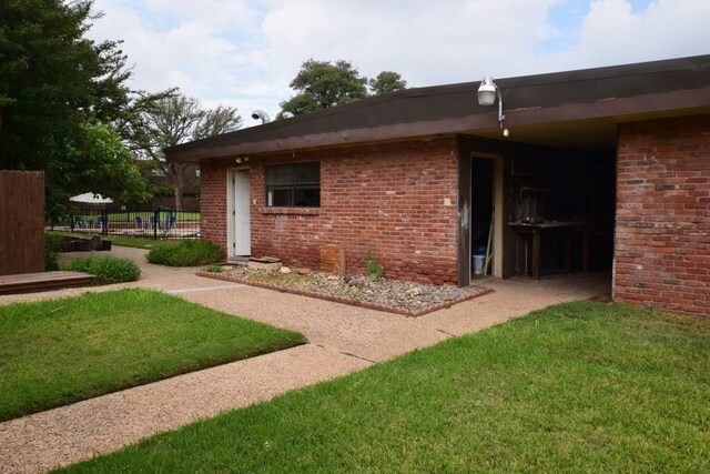 property entrance with brick siding