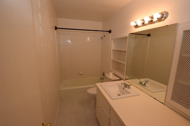 bathroom featuring toilet, tile patterned floors, vanity, and shower / tub combo