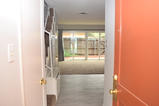 hall with wood finished floors