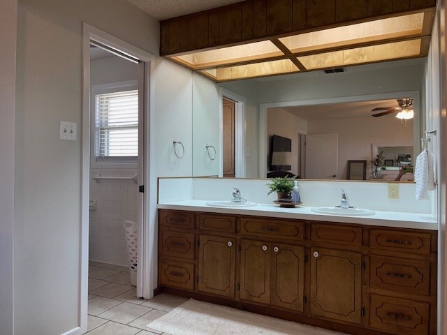 4500 El Paso, Snyder, TX 79549 - bathroom with double vanity, tile patterned flooring, and a ceiling fan