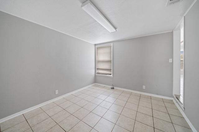1309 Marijo, Big Spring, TX 79720 - unfurnished room with light tile patterned floors and baseboards