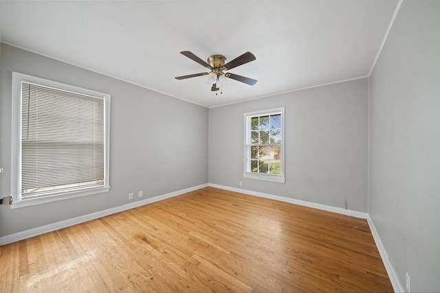 1309 Marijo, Big Spring, TX 79720 - empty room with light wood finished floors, a ceiling fan, and crown molding