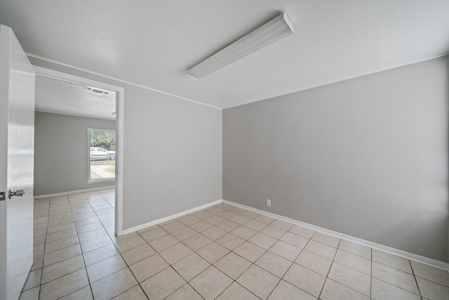 1309 Marijo, Big Spring, TX 79720 - unfurnished room featuring light tile patterned flooring and baseboards