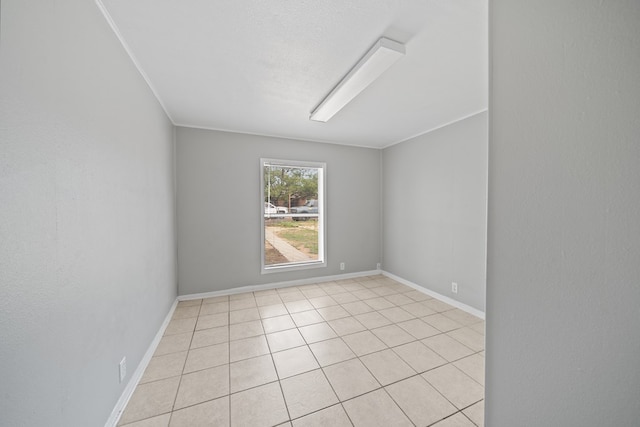 1309 Marijo, Big Spring, TX 79720 - empty room featuring light tile patterned flooring and baseboards
