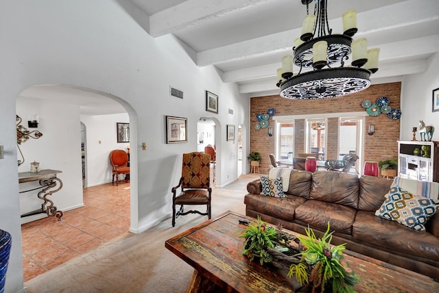 2309 W Golf Course Rd, Midland, TX 79701 - living area featuring baseboards, beam ceiling, light tile patterned flooring, an inviting chandelier, and arched walkways