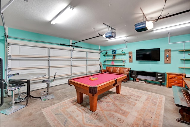 2309 W Golf Course Rd, Midland, TX 79701 - rec room featuring a textured ceiling, concrete flooring, a garage, and pool table
