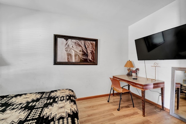 2309 W Golf Course Rd, Midland, TX 79701 - bedroom with wood finished floors and baseboards