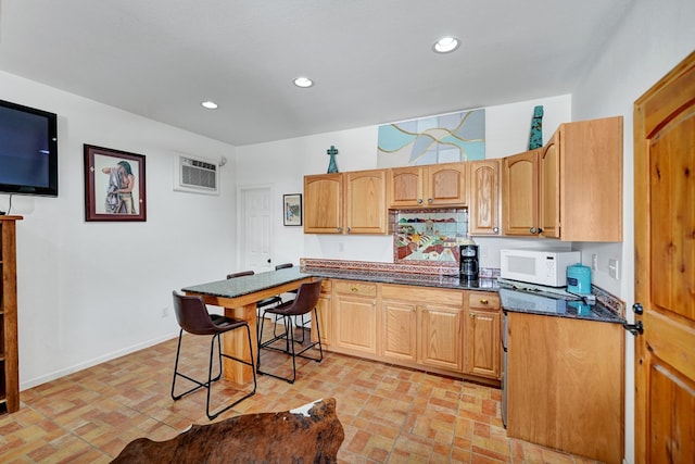 2309 W Golf Course Rd, Midland, TX 79701 - kitchen featuring baseboards, recessed lighting, brick floor, and white microwave