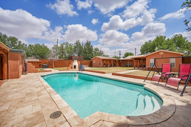 2309 W Golf Course Rd, Midland, TX 79701 - view of pool featuring a fenced backyard, a fenced in pool, and a patio area