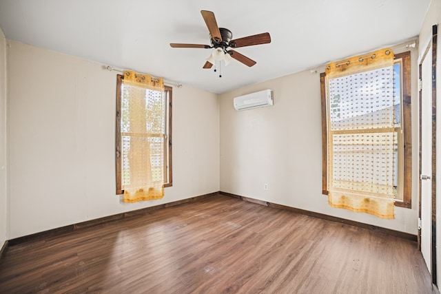 904 E Hester St, Brownfield, TX 79316 - spare room with a wall mounted AC, wood finished floors, baseboards, and ceiling fan