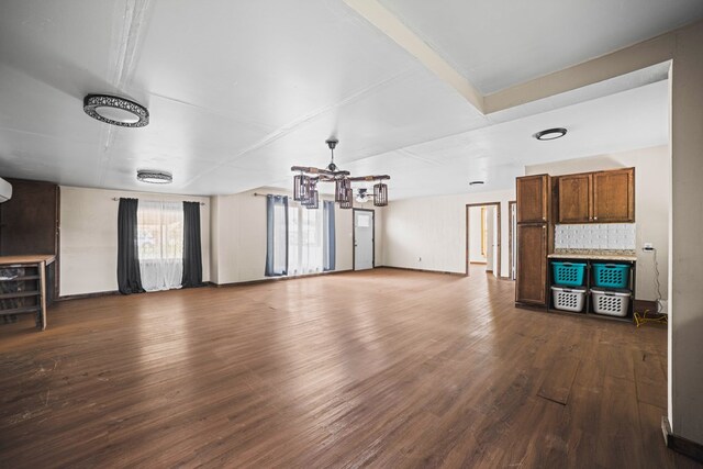 904 E Hester St, Brownfield, TX 79316 - unfurnished living room featuring dark wood finished floors