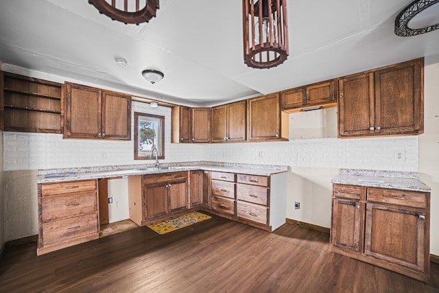 904 E Hester St, Brownfield, TX 79316 - kitchen featuring a sink, dark wood-style flooring, tasteful backsplash, and open shelves