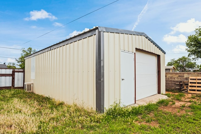 904 E Hester St, Brownfield, TX 79316 - view of outbuilding featuring fence, cooling unit, and an outdoor structure