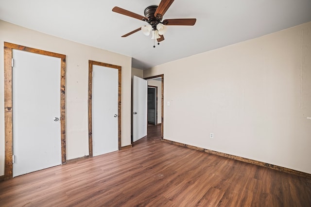 904 E Hester St, Brownfield, TX 79316 - unfurnished bedroom featuring wood finished floors, a ceiling fan, and baseboards