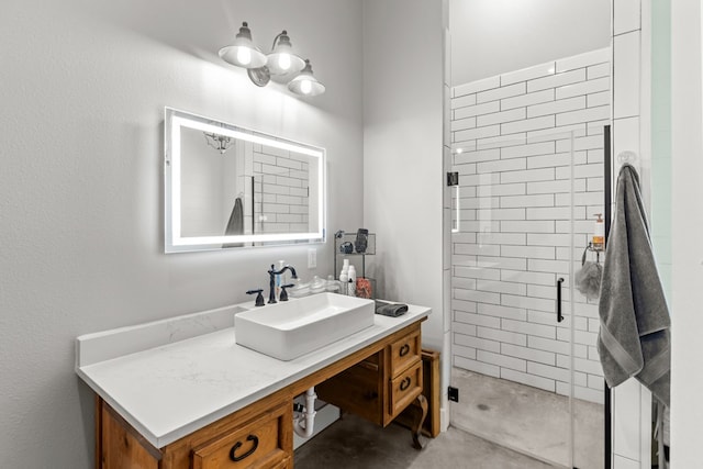 bathroom featuring vanity and an enclosed shower