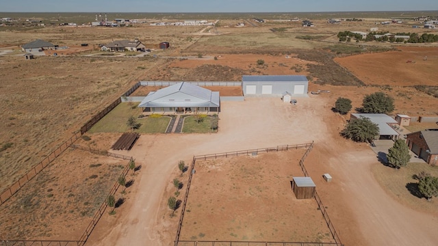 birds eye view of property featuring a rural view