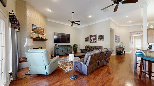living room featuring wood finished floors, a fireplace, baseboards, ceiling fan, and recessed lighting